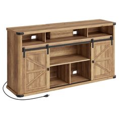 a large wooden entertainment center with sliding doors