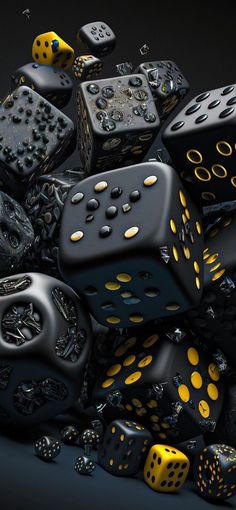 a pile of black and yellow dices sitting on top of each other in front of a black background