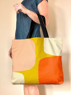 "Meet my mid century style Abstract Shapes bag, a large tote bag in warm neutral and gold, pink and orange. This oversized tote bag with a retro Scandinavian design bag has zillion use If you're a fan of oversized totes, look no further -great for market, travel, gym, beach and overnight Check out the handy wallet sized pockets on the inside, the bag is fully lined with a snap closure. This colorful bag is a great girlfriend or hostess gift, mostly I'm seeing folks nab them for theirselves (enco Large Capacity Retro Canvas Shoulder Bag, Retro Canvas Bag With Large Capacity For Shopping, Retro Large Capacity Canvas Shopping Bag, Retro Canvas Bag With Large Capacity For Daily Use, Retro Large Capacity Canvas Bag For Travel, Retro Rectangular Canvas Bag For Daily Use, Retro Canvas Travel Bag, Retro Canvas Shoulder Bag For Travel, Retro Canvas Tote Bag For Shopping