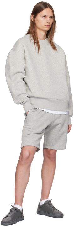 Boxy-fit cotton-blend fleece sweatshirt. · Rib knit crewneck, hem, and cuffs · Logo embossed at chest · Logo embroidered at back collar Supplier color: Ash grey Crew Neck Cotton Fleece Hoodie With Ribbed Cuffs, Cotton Fleece Hoodie With Ribbed Cuffs And Crew Neck, Cotton Sweats With Ribbed Cuffs And Straight Hem, Cotton Athleisure Sweatshirt With Elastic Cuffs, Casual Cotton Fleece Sweatshirt With Ribbed Cuffs, Relaxed Fit Sweats With Ribbed Cuffs In Cotton Fleece, Fall Sweats With Ribbed Cuffs And Straight Hem, Cotton Sweats With Ribbed Cuffs And Crew Neck, Cotton Crew Sweats With Ribbed Cuffs