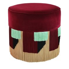 a round ottoman with fringes on the top and bottom in maroon, green, beige and black