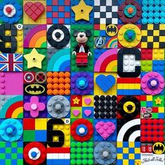 a wall made out of legos and other things that are all different colors, shapes and sizes