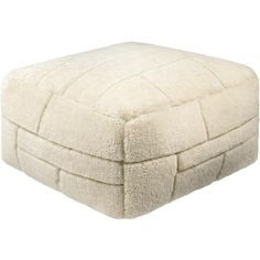 a white square ottoman cushion on a white background