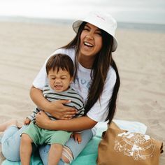 Introducing our "Love Your Mother" Bucket Hat, the perfect accessory for any mom who loves spending time in the sun! This white bucket hat features bright pink stitching of "Love Your Mother," making it a stylish and meaningful addition to any outfit. Our hat is made from 100% cotton, making it light-mid weight and comfortable to wear. The reinforced brim with stitching detail and side eyelets add a touch of style and functionality, providing extra protection from the sun and ensuring a comforta White Sun Hat With Uv Protection For Playtime, White Summer Sun Hat For Playtime, Playful Cotton Sun Hat Cap, Casual Sun Hat With Upf 50+ For Picnic, Playful Cotton Sun Hat For Vacation, Casual Cotton Sun Hat For Beach Season, White Bucket Hat For Spring Playtime, Playful White Bucket Sun Hat, White Bucket Hat For Summer Playtime