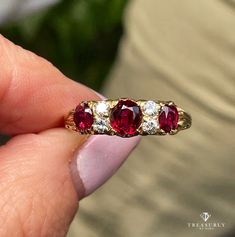 A Beautiful Classic VICTORIAN revival Trilogy Diamond Ring with Three SUPER RARE Gorgeous Ruby, create a hypnotic radiance and luster with splash of color.Three bright faceted antique Oval Rubies are beyond words!! A NATURAL, NO HEAT in Deep Pigeon Blood Vivid Red Transparent Color from from Thailand (formerly Siam), glistens and glows in between 2 vertically set round diamonds. Totaling just under 2cts (approx. 1.80 ctw). Measuring from 4.53x3.72x2.11 to 5.45x4.78x3.09mm. Accompanied by gemolog Luxury Oval Tourmaline Ruby Ring, Luxury Ruby Ring With Diamond Accents As Gift, Luxury Classic Lab-created Ruby Ring, Vintage Ruby Ring Victorian, Ruby And Diamond Ring Engagement, Luxury Fine Jewelry Rings With Lab-created Ruby, Victorian Ruby Ring, Ruby Engagement Ring Vintage Unique, Red Diamond Cluster Ring With Vvs Clarity