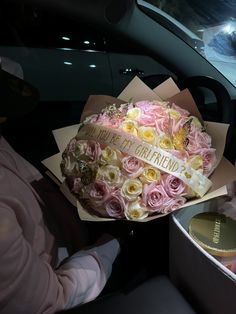 a bouquet of pink and white roses in a box with a ribbon that says i love my friend