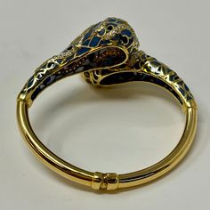 18K Gold Hinged Snake Bracelet with Diamonds and Enamel (includes appraisal, Value: $9,000) Designer = Jewelry Material = 18K Gold Gemstone = Diamond Condition = Very Good Class = Premier Location: Wilmette Item Number: 11750-314 Item ID: 279025 Category: Bracelet Designer Enamel Bangle Jewelry, Luxury Hallmarked Bracelets For Collectors, Luxury Yellow Gold Bangle For Evening, Luxury Jeweled Yellow Gold Jewelry, Luxury Ceremonial Bracelets, Designer Gold Bracelets With Black Enamel, Yellow Gold Jeweled Bracelets For Formal Occasions, Jeweled Yellow Gold Bracelets For Formal Occasions, Yellow Gold Jeweled Bracelet For Formal Occasions