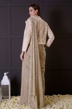 Gold pre-draped saree in imported shimmer base. Comes with an ivory bamberg silk blouse with leaf and pearls hand embroidered neckline and a jacket. - Aza Fashions Gold Saree, Embroidered Leaf, Draped Saree, Embroidered Leaves, Drape Saree, Embroidered Neckline, Jacket For Women, Fashion App, Embroidered Jacket