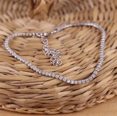 This is solid 925 Sterling Silver tennis bracelet with cubic zirconia.     925 stamped. Approx. measures:    Bracelet width: 2mm    Length:  6.7 Inch(17 cm)+1 Inch(2.0cm) adjustable.          Approx. weight: 3.6gr.                                  Presented in gift box.           Thank you for looking! Diamond-cut Crystal Tennis Bracelet As A Gift, Diamond Cut Crystal Tennis Bracelet As Gift, Crystal Tennis Bracelet With Diamond Accents As Gift, Gift Crystal Tennis Bracelet With Diamond Accents, Dazzling Sterling Silver Bracelet With Diamond Cut, Dazzling Sterling Silver Bracelet With Diamond Cut For Gifts, Crystal Tennis Bracelet With Brilliant Cut For Gift, Crystal Diamond Bracelet As Gift, Diamond White Sparkling Tennis Bracelet As Gift