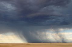 a storm is coming in over the plains