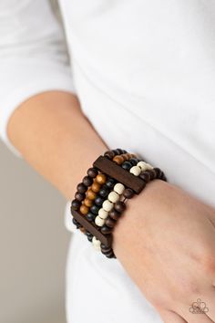 a close up of a person wearing a bracelet with beads on their wrist and hand