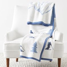 Capture the carefree spirit of a day at sea with our new ChappyWrap Throws. Designed by New England locals, this nautical-inspired collection is filled with whimsical sailboats, ocean critters, and the iconic peninsulas from Cape Cod to Martha's Vineyard. Made from a beautifully soft, easy-to-care-for cotton, these reversible ChappyWrap throws are an instant favorite for lobster bakes, lounging, and coastal dreaming alike. Have your family name or the name of your beachside cabin embroidered on Beachside Cabin, Coastal Blanket, Winter Motifs, Lobster Shack, Holiday Throw, Cuddling On The Couch, Festive Collection, Mark And Graham, Best Build