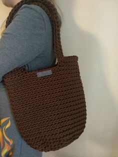 Handmade crochet tote bag is stylish and functional. Crochet tote handbag can be used as a shopping tote, market tote bag or handbag. Handmade crochet tote bag is exclusive and can be a great gift for women. COLOR: brown SIZE: Height : 35 cm (14 inches) Height with handles: 55 cm (21.6 inches) Width: 28 cm (11 inches) ITEM CARE: Hand wash or machine wash. Initial water temperature should not exceed 30C or 65F. Please note that the tote bag might stretch when using it. IMPORTANT: - This tote bag is handmade. - Tote bag is made from polyester cord. - If you need different color, size, please do not hesitate and send me a message or a custom order request. - Please note that the colors might vary due to computer monitor settings and lightening. - The tote bag is made to order. And as the tote Everyday Rectangular Crochet Bucket Bag, Casual Crochet Bag With Large Capacity For Market, Casual Crochet Bag For Market With Large Capacity, Large Capacity Brown Crochet Satchel Bag, Handmade Casual Hobo Bag For Market, Casual Handmade Hobo Bag, Casual Hand Knitted Shoulder Bag For Everyday, Hand Knitted Shoulder Bag, Casual Everyday Hand Knitted Shoulder Bag