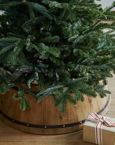 a small christmas tree in a wooden container