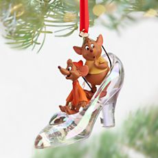 a christmas ornament with two dogs riding on a sleigh