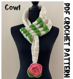 a crocheted flower scarf on a mannequin headpiece with the words cowl written below it