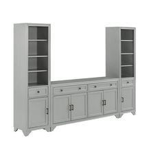 a gray bookcase with two doors and three cupboards on one side, an open door to the other