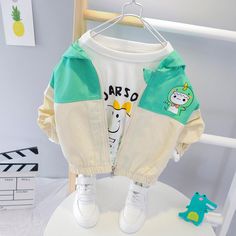 Girls Cute Hooded Long Sleeve Zipper Jackets - PrettyKid Playful Long Sleeve Outerwear For Outdoor, Green Cotton Outerwear With Zipper Closure, Playful White Long Sleeve Outerwear, Green Patchwork Long Sleeve Track Jacket, Green Long Sleeve Patchwork Track Jacket, Playful Cotton Outerwear For Outdoor, Cotton Patchwork Long Sleeve Track Jacket, Stretch Cotton Hooded Outerwear, Cotton Long Sleeve Track Jacket With Patchwork