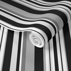 a black and white striped wallpaper with a circular hole in the center on it