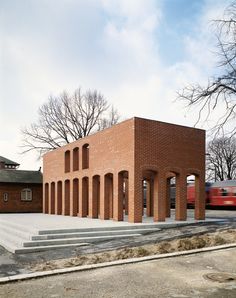 a brick building sitting on the side of a road