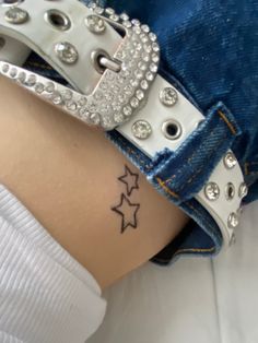 a woman's thigh with three stars on it