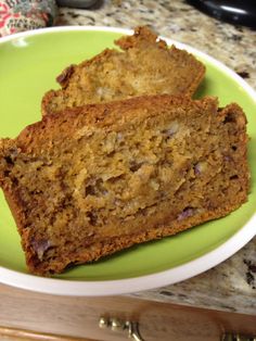 two slices of banana bread on a green plate