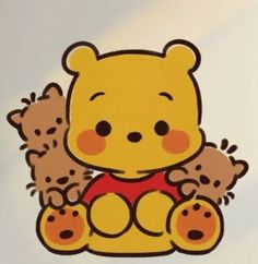 a winnie the pooh sticker sitting on top of a white table next to two teddy bears