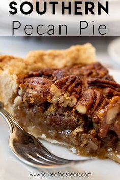 a piece of pecan pie on a plate with a fork