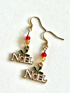 Perfect for celebrating Christmas, these enameled Noel holly earrings will add a splash of color and special meaning to your festive attire. These feature faceted glass for a touch of sparkle and hang from gold plated ear wires. Please scroll photos for close ups. For a guide on the size, please see photo 4. These festive drops come packaged in a gift bag ready for gift giving. Holiday Happy Dance is a festive and fun jewelry collection that celebrates holidays and occasions throughout the year. Holly Earrings, Festive Attire, Celebrating Christmas, Fun Jewelry, Earrings Christmas, Happy Dance, Donate To Charity, Christmas Earrings, Faceted Glass