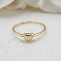 Beautiful stackable solid 14k gold mini polished yellow gold heart ring. Perfect to wear everyday, everywhere. Adorable, modern and everlasting. 14k Gold will not tarnish or rust. Perfect gift ! Materials: 14k Solid Yellow Gold Sizes: 5 to 10 Us Weight: 1.1 grams (approx) 14k stamped Brand new Fast shipping Elegant gift box included  Briza Collections is a small family owned business that works hard on providing the best selection of Fine Solid 14k Gold Jewelry for the best prices.  Our main goa Gold Heart-shaped Stackable Midi Rings, Gold Stackable Heart Midi Rings, Classic Stackable Yellow Gold Heart Ring, Everyday Open Heart Rings With Heart Charm, Gold Stackable Rings With Heart Charm In 14k Gold, Stackable Yellow Gold Heart Ring, Fine Jewelry Stackable Gold Heart Ring, Gold Stackable Heart Ring In Fine Jewelry Style, Dainty Stackable Yellow Gold Heart Ring