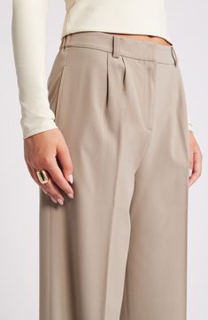 Move from desk days to drinks dates in gracefully draped pants cut from a feel-good fabric. 30" inseam; 24" leg opening; 13" front rise; 16 1/2" back rise (size 8) Zip fly with hook-and-bar closure 62% REPREVE® recycled polyester, 33% rayon, 5% spandex REPREVE recycled polyester is made from 100% post-consumer recycled plastic bottles Machine wash, tumble dry Imported Spring Wide-leg Tapered Pants, Beige Tapered Leg Dress Pants, Beige Tapered Pants, Elegant Tapered Pants For Fall, Elegant Tapered Fall Pants, Tapered Beige Pants, Elegant Wide Leg Tapered Pants, Elegant Tapered Wide Leg Pants, Elegant Tapered Wide-leg Pants