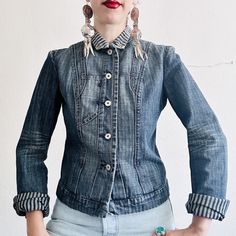 "90s vintage denim jean jacket by French designer Marithé Francois Girbaud     - Fitted tailored silhouette     - Intricate dart and seaming details     - Rolled collar with contrasting stripe fabric     - Girbaud emblem snaps     - Unlined     - Unique shoulder details     - whiskering at elbows     - nonstretch medium wash denim REFER TO THESE MEASUREMENTS CAREFULLY, AS RETURNS ARE NOT ACCEPTED: Marked size Medium...runs small...fits like a size small.      Pit to pit: 18.5\"     Waist: 16\"     Hip: 17.5\"     Sleeve length: 25.5\" (meant to be rolled up)     Length (midshoulder - hem): 20\"     Shoulder tip to tip: 16\" Excellent used condition  Shell: 100% Cotton  Military, rocker, chorewear, workwear, streetwear, utility, menswear To complete the look, Sangre de Cristo Vintage origin Utility Menswear, Francois Girbaud, Rolled Collar, Vintage Denim Jeans, Stripe Fabric, French Designer, Denim Jean Jacket, Striped Fabrics, French Design