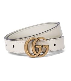 Cinch ensembles in style with this slim calf leather belt from Gucci. Fastening with an iconic antique golden GG buckle, it arrives in versatile white for a touch of '60s flair. Let yours enhance sharp suiting and off-duty denim alike. Classic Leather Belt With Gold-tone Logo Plaque, Designer White Leather Belts, Gucci Designer Leather Belt, Gucci Leather Belt Buckle With Removable Belt, Luxury Gucci Leather Belt, Gucci Formal Belt With Metal Logo, Designer White Belts For Formal Occasion, Designer White Belt For Formal Occasions, Chic Gucci Belt For Formal Occasions