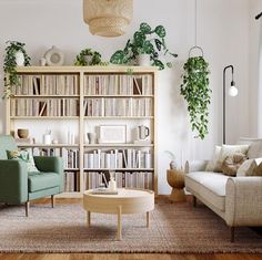 a living room filled with furniture and bookshelves next to a large book shelf