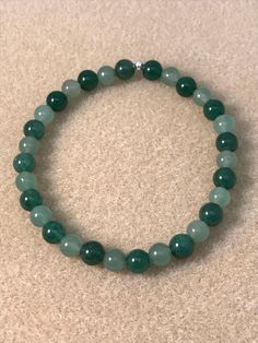 "Lovely 6mm sparkly green aventurine bracelets. Choose your color, these stacking bracelets come in a light spring green, a darker emerald to forest green, and and alternating mixed green or as a set of 3 (1 of each style) for layering. Unless you are purchasing the set of 3 stretch bracelets, the price is for (1) one beaded bracelet in your desired shade. //SIZE: * 6mm beads * Custom made to fit YOU, select your BRACELET size (not wrist size) from drop-down box. * Need a size not listed? Messag Green Aventurine Beaded Bracelets, Aventurine 8mm Bead Bracelet, Adjustable Green Aventurine Crystal Bracelet, Adjustable Hand-strung Aventurine Beaded Bracelets, Green Aventurine Bracelet, Aventurine Bracelet, Green Aventurine Beaded Hand-strung Necklace, Jewelry Mens, Stacking Bracelets