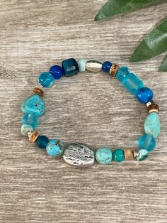 Aqua beachy mix of semi precious stones , glass , wood and shell beads. Coastal vibe🌴☀️😎 Blue Wooden Beaded Bracelets For Beach, Casual Turquoise Stretch Bracelet With Natural Stones, Blue Spiritual Stretch Bracelet For Beach, Spiritual Blue Stretch Bracelet For Beach, Bohemian Stretch Bracelet With Gemstone Beads For Beach, Beach Stretch Bracelet With Gemstone Beads, Beach Stretch Bracelet With Round Gemstone Beads, Stretch Bracelet With Gemstone Round Beads For Beach, Casual Beach Beaded Bracelets With Natural Stones