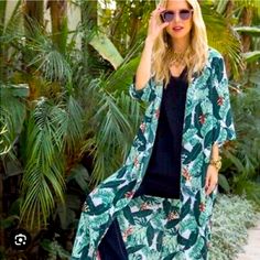 Rachel Zoe Palm Floral Kimono Beach Wrap Coverup Duster One Size The Rachel Zoe Swim Rachel Zoe Palm Duster Is A Cover-Up That Can Be Worn As A Swim Cover Or As A Light Top Layer. It Has A Tassel Tie Front And A Tropical Print. It Can Be Paired With A Slip And Belt For A Unique Wrap Dress. * Tropical Leaf Print * Kimono Style Duster With Tassels * Polyester * One Size * $200 Retail * V-Neck, 3/4 Sleeves * Measurements: - Shoulders: 18 Inches - Length: 48 Inches - Sleeve Length: 15 Inches. * Nwt Casual Short Sleeve Resort Cover-up, Summer Tropical Print Cover-up, Casual Printed Resort Cover-up, Summer Printed Cover-up For Day Out, Casual Floral Print Cover-up For Beach Party, Casual Beach Party Cover-up With Floral Print, Casual Summer Tropical Print Cover-up, Casual Vacation Cover-up With Open Front, Casual Open Front Cover-up With Floral Print