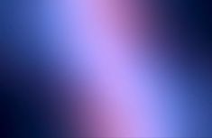 a blurry image of blue and pink colors