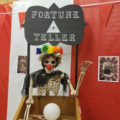 a fake skeleton in a box with a clown face on it's head and hands