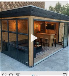 a small backyard office with an outside bar