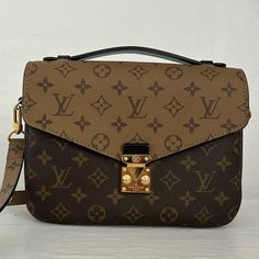 Louis Vuitton Pochette Metis Shoulder Bag Mm Brown Leather Monogram Reverse. Beautiful Monogram Reverse Leather Print. Dimensions Are; 9.8” X 7.5” X 2.8” Monogram Reverse Coated Canvas. Colored Cow Hide Leather Trim. Textile Clean Lining, No Marks Or Scuffs. From Smoke Free Home. Gold Color Hardware. S Lock Closure. Outside Zipper Pocket. Three Inside Compartments. Removable And Adjustable Strap. Strap Drop Is 18.9” With Max Drop Of 21.7” Worn Only A Handful Of Times. Excellent Condition. Kept I Pochette Louis Vuitton, Louis Vuitton Pochette Metis, Louis Vuitton Pochette, Printed Leather, Leather Trims, Zipper Pocket, Cowhide Leather, Adjustable Straps, Louis Vuitton Bag