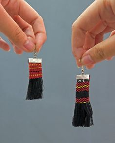 Handwoven tassel earrings from Mabilong, Kalinga, a village known for its weaving. Beautifully handmade from woven fabric with hand-beaded details. DETAILS Size: 2.75" x 5/8". Tassel: Approx. 2" long x 5/8" wide. Make: Completely handmade with handwoven fabric, hand-beaded, and hand-sewn. Slight variations in patterning and weaving make each pair unique. Read more about Kalinga weaving here. Traditional Adjustable Handwoven Beaded Earrings, Handwoven Black Jewelry For The Beach, Black Handwoven Jewelry For Beach, Black Handwoven Jewelry For The Beach, Traditional Beaded Earrings With Fringe For Festivals, Traditional Beaded Fringe Earrings For Festival, Traditional Woven Earrings, Traditional Woven Dangle Jewelry, Traditional Woven Earrings For Festivals