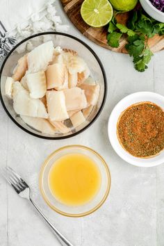 the ingredients to make this dish include fish, limes and seasoning in bowls