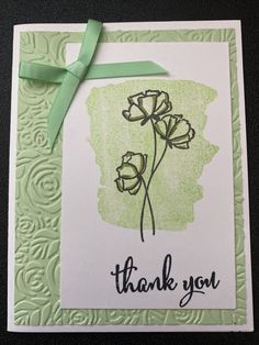 a thank card with some flowers on it