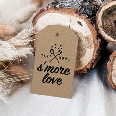 there is a tag that says take home s'more love next to some logs