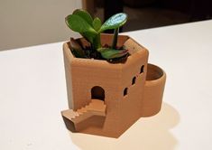 a planter made out of cardboard sitting on top of a table