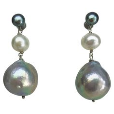 These beautiful and elegant earrings are handmade with a fine 4mm dark grey pearl, a 6mm white pearl, and a 15mm light grey pearl with 14K white gold for the wiring and stud. They are 1.25 inches in length. Perfect for every occasion, highlighting the face and jawline. The three-color pearls match everything you wear in your outfit. **All jewelry is handmade by the designer for any custom sizing, color, material, or any other requests, please contact Marina J. Price may vary accordingly.** Grey Pearl Earrings, Tahitian Pearl Earrings, White Gold Diamond Earrings, White Gold Studs, Simple Stud Earrings, Baroque Pearl Earrings, Gold Diamond Earrings, Pearl Earrings Dangle, White Earrings