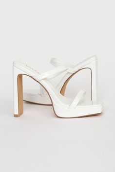 Who wouldn't be completely obsessed with the Lulus Fausee White Patent Square Toe Platform Slide Sandals! Sleek patent faux leather shapes these heels with a trendy square footbed (with a 0.5"" toe platform), a slender toe strap, and a matching vamp strap with a bit of elastic at the side. An easy-to-slide-on design tops a sky-high blade heel for a chic look! 4. 5" wrapped heel. Cushioned insole. Rubber sole has nonskid markings. Man made materials. Imported. Lulus | Fausee White Patent Square T White Platform Heels With Square Toe, Square Toe Patent Leather Platform Heels, Sleek Patent Leather Platform Sandals, White Square Toe Platform Heels, Chic Chunky Platform Sandals In Patent Leather, Chunky Platform Open Heel In Patent Leather, Chunky Platform Heels In Patent Leather With Open Heel, Summer Patent Leather Heels With Square Toe, Patent Leather Heels With Chunky Platform And Open Heel