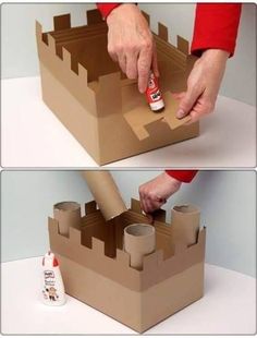 a cardboard castle made to look like it is being put into the box with glue