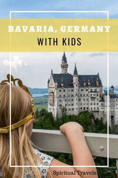 a girl looking out over a castle with the words bavara, germany with kids